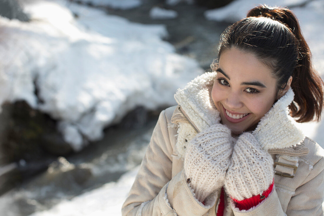 Portrait of smiling woman in snow