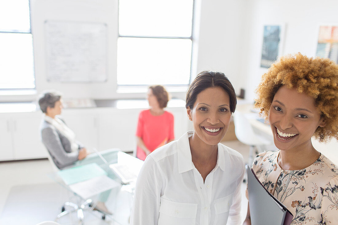 Portrait of two smiling business women