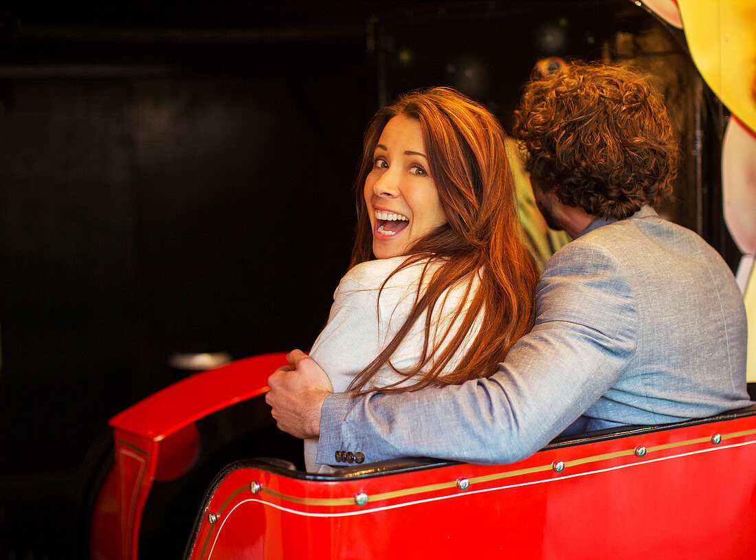 Man embracing scared girlfriend