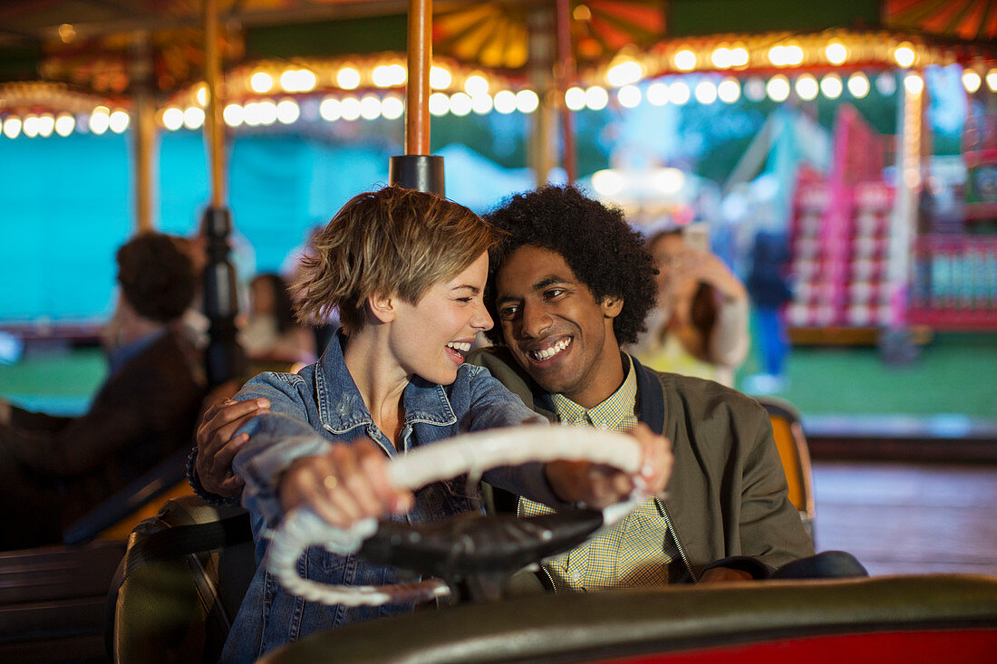 Young couple on bumper car ride
