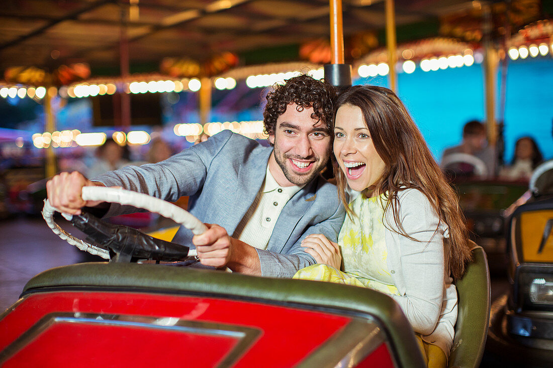 Couple on bumper car ride