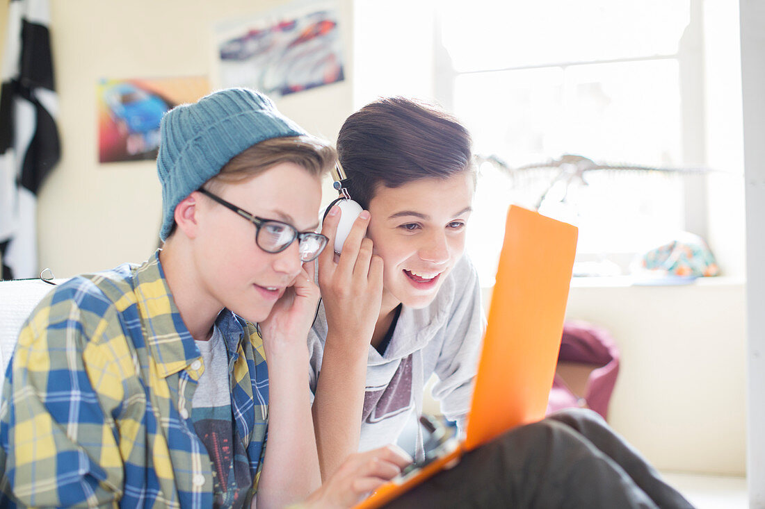 Boys sharing laptop