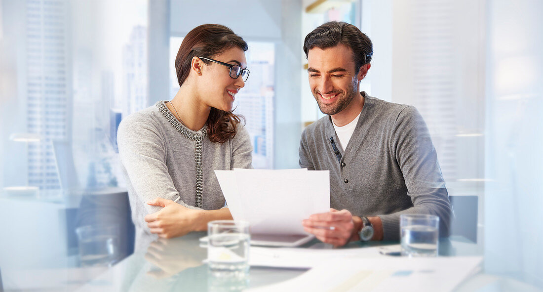 Man and woman working together in office