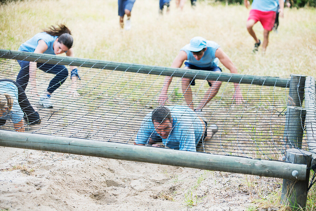 People crawling under net