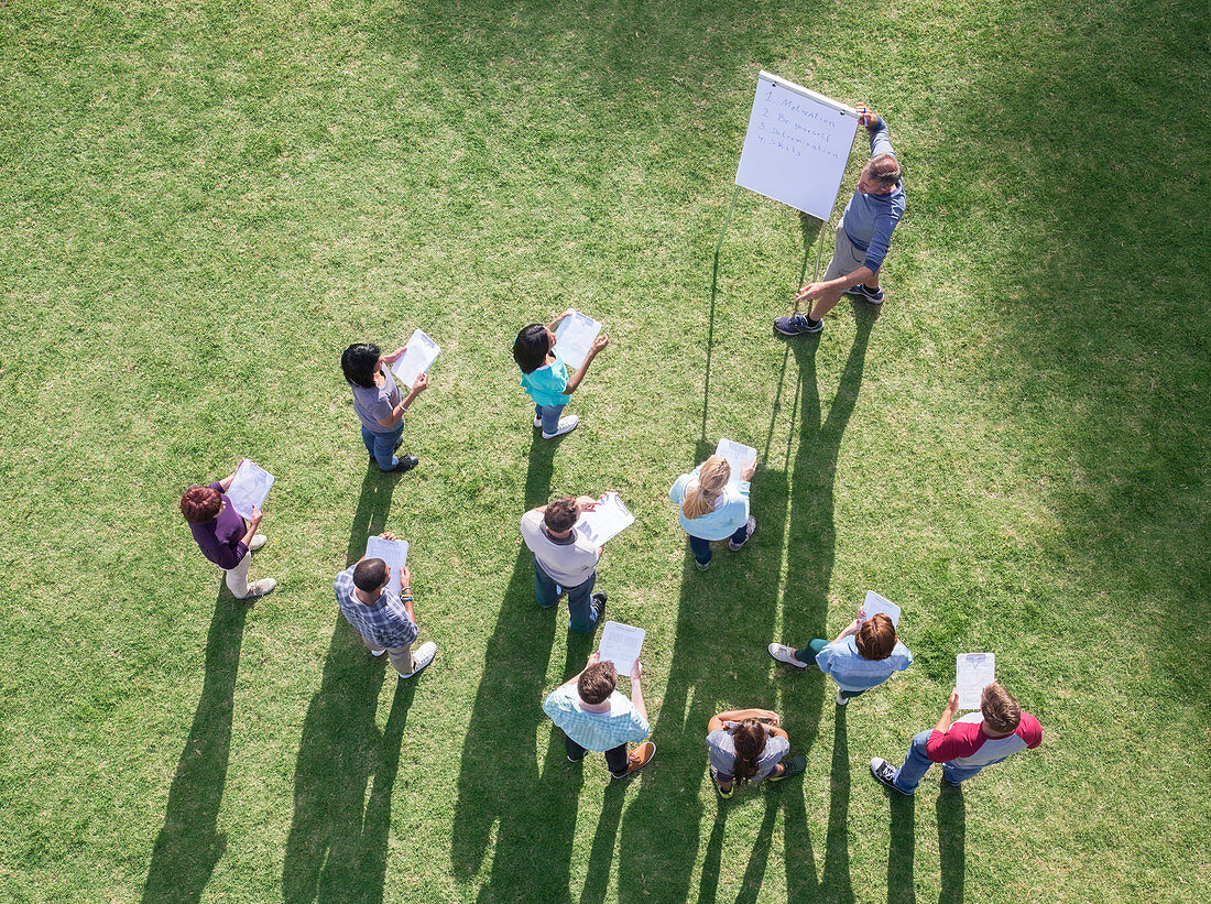 Businessman leading meeting at flipchart