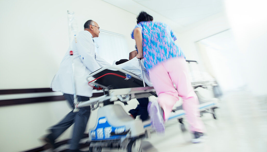 Doctor and nurse rushing patient