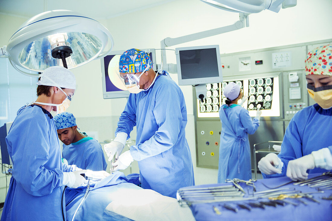 Surgeons during surgery in operating room
