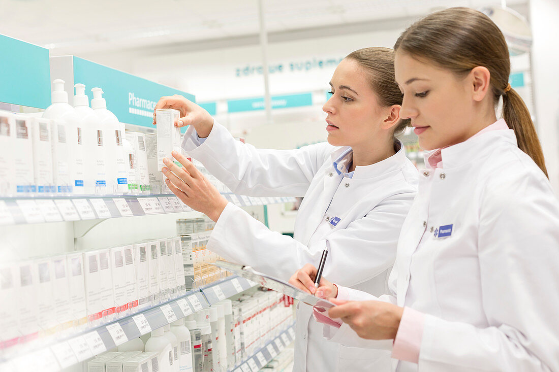 Pharmacists taking inventory in pharmacy