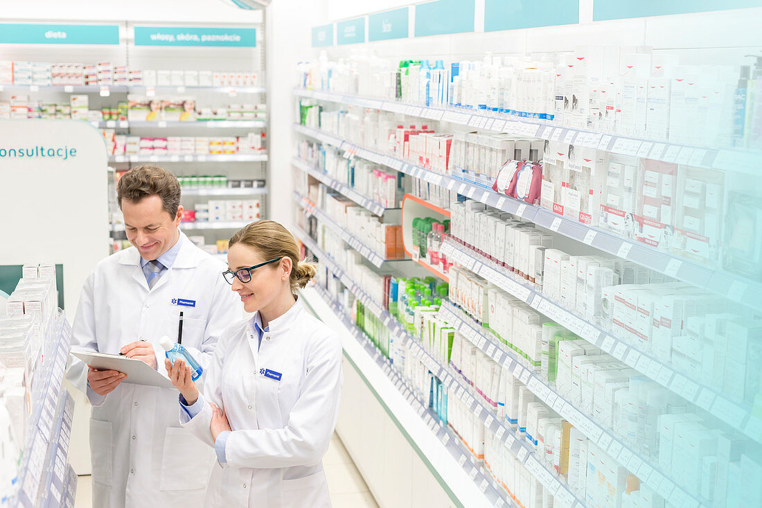 Pharmacists taking inventory in pharmacy