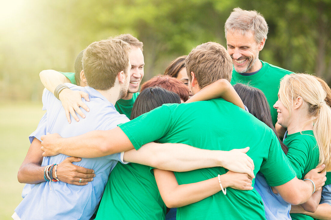 Team hugging in huddle