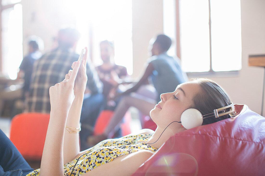 Businesswoman relaxing and tablet