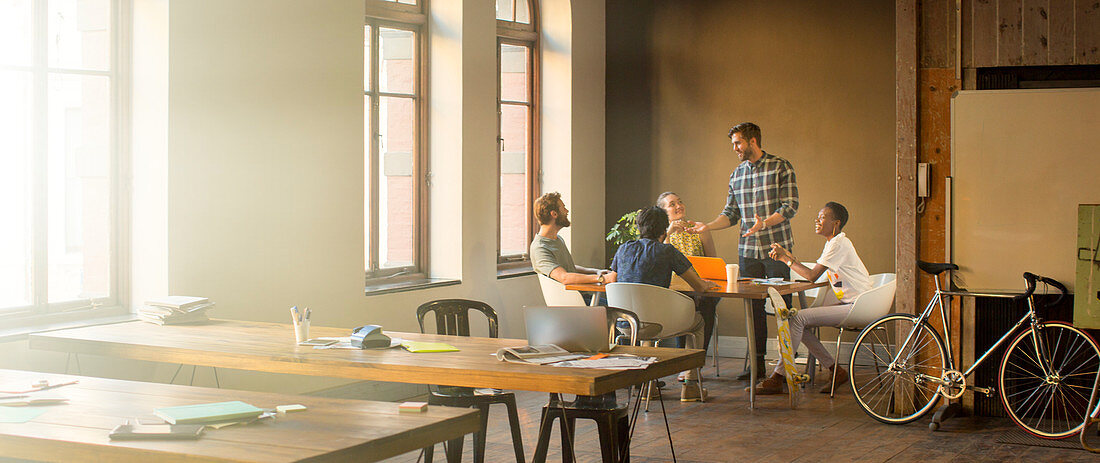 Businessman leading meeting at table