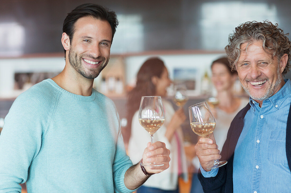 Men wine tasting at winery tasting room