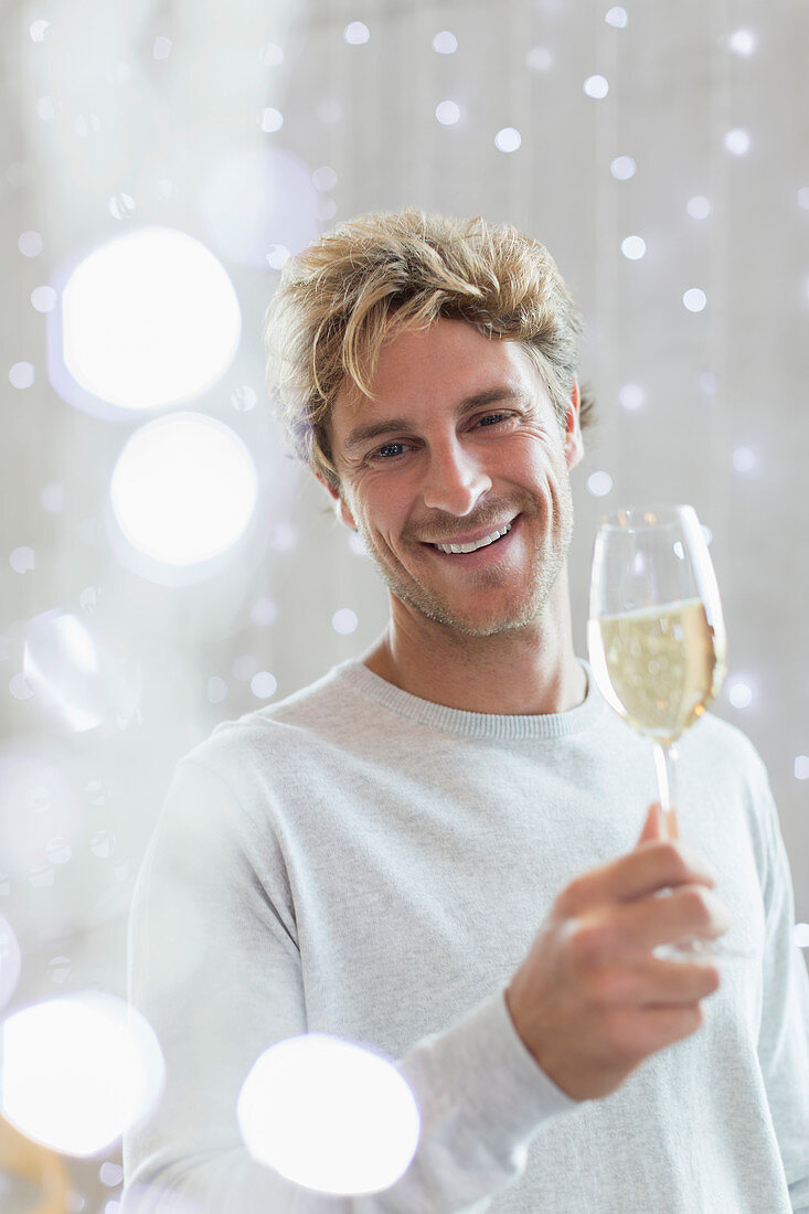 Portrait smiling man drinking white wine