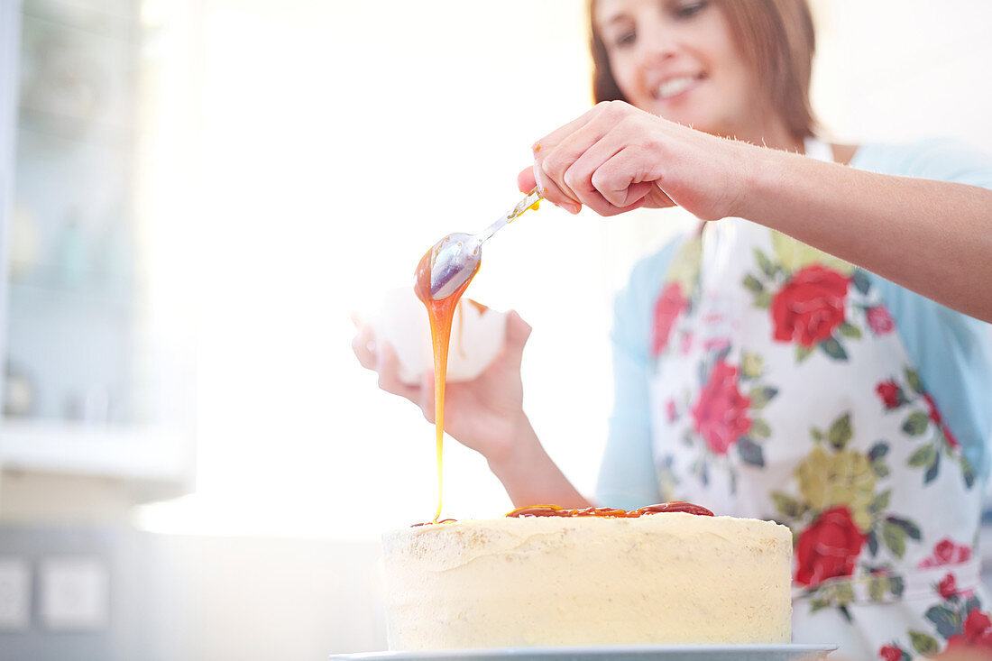 Woman pouring caramel