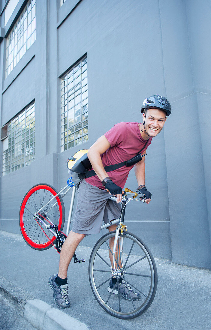 Bicycle messenger leaning forward