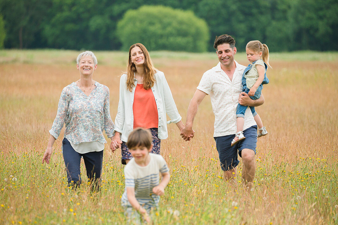 Family holding hands and walking