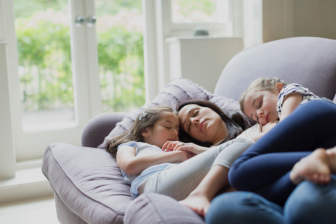 Mother and daughters napping