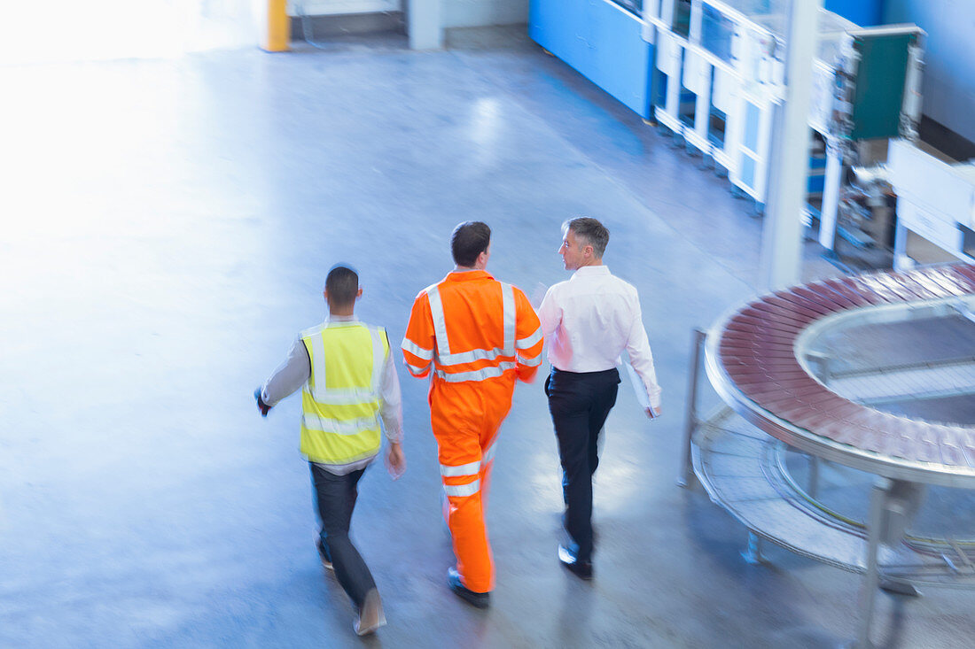 Workers in reflective clothing walking