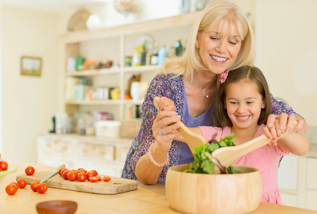 Grandmother and granddaughter with salad
