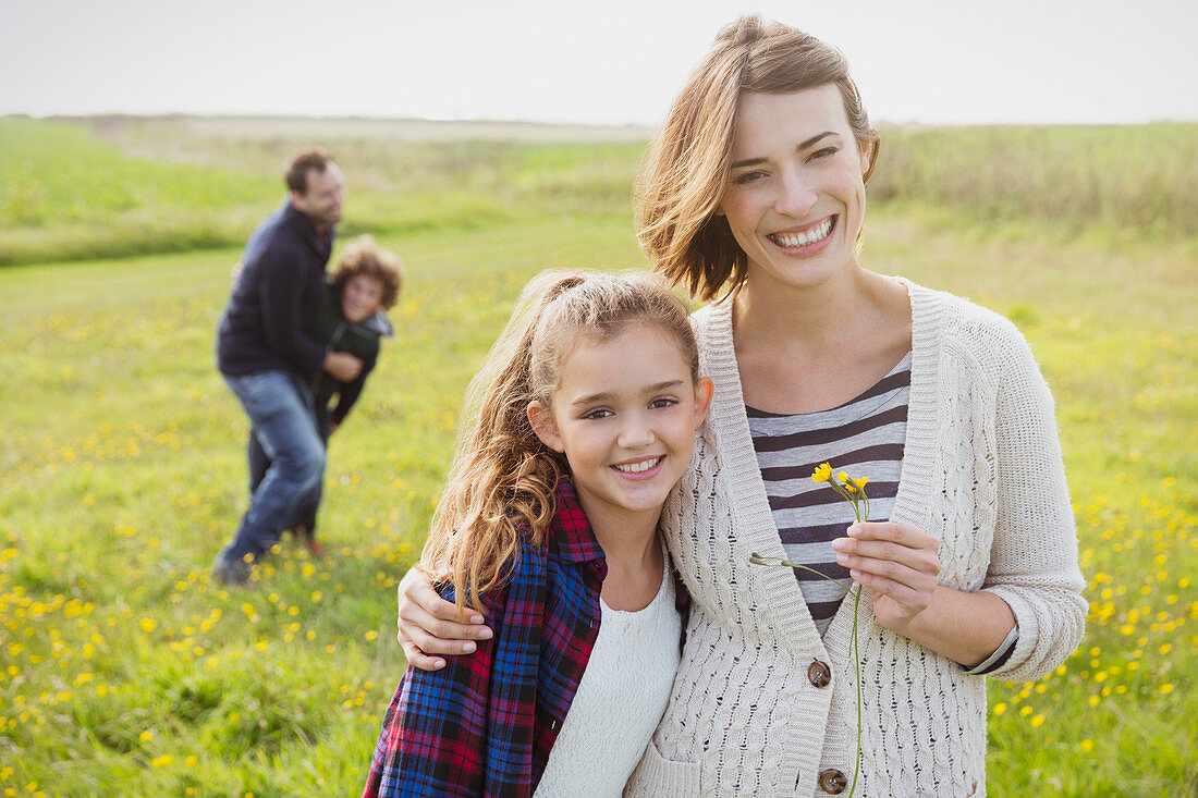 Mother and daughter in meadow