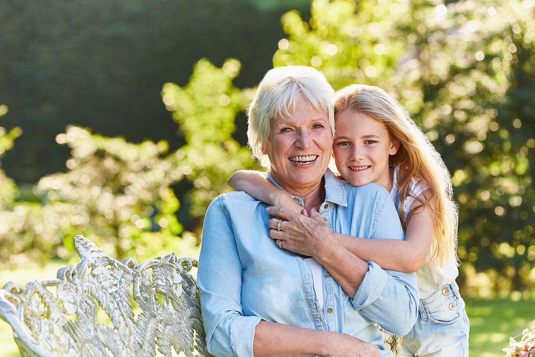 Grandmother and granddaughter hugging