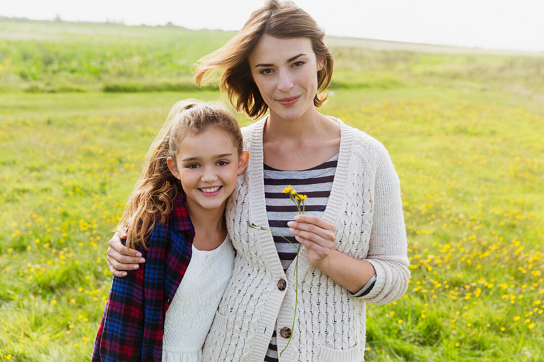 Mother and daughter in meadow