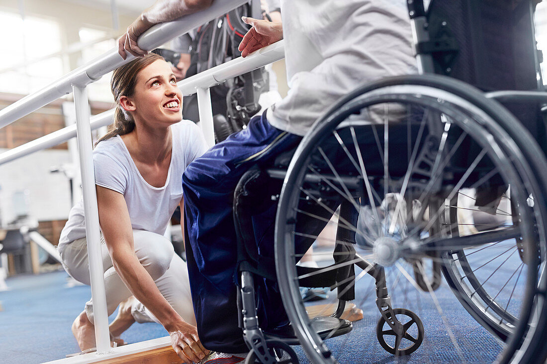 Physiotherapist preparing wheelchair user