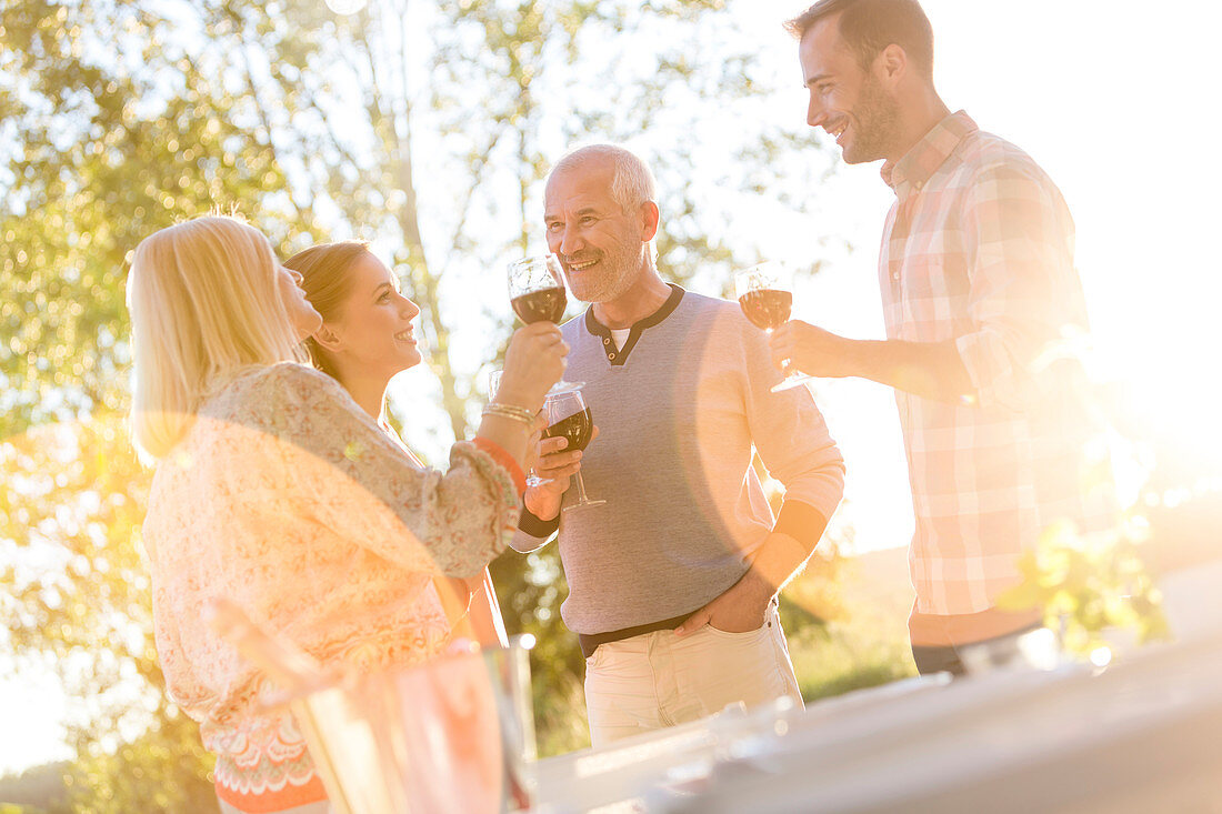 Parents and adult children drinking wine