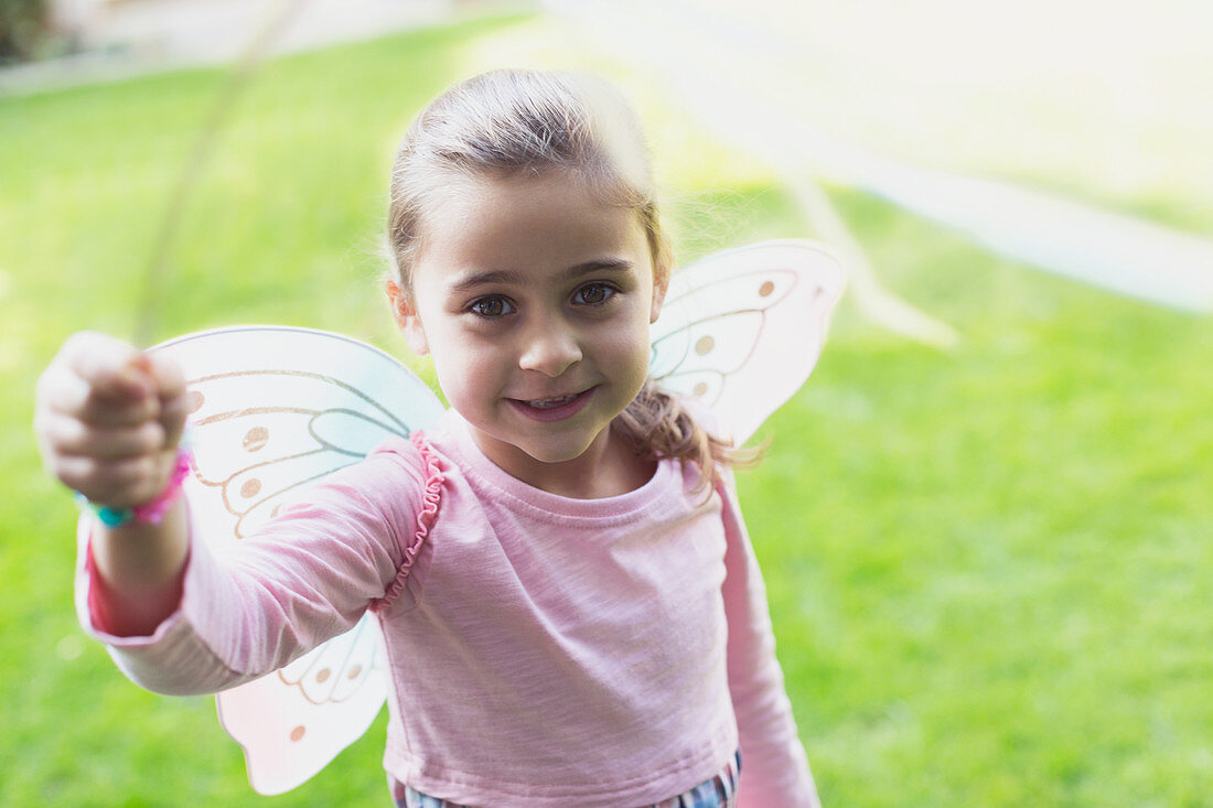 Portrait smiling girl in fairy wings