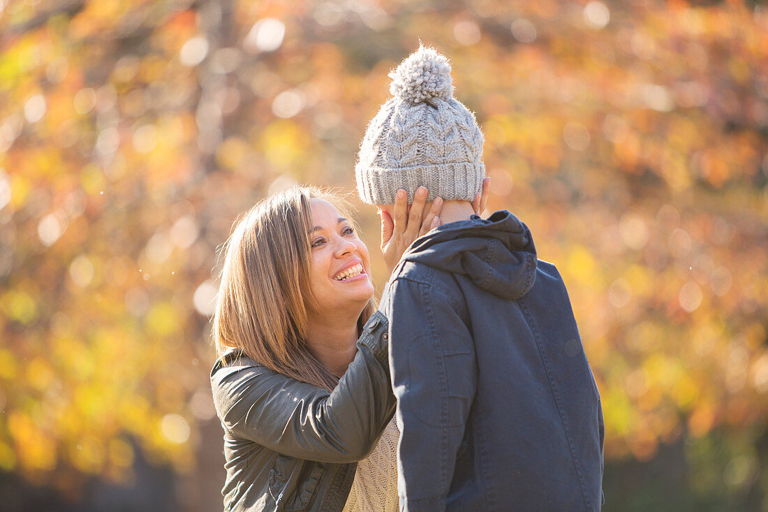 Affectionate mother touching son's face