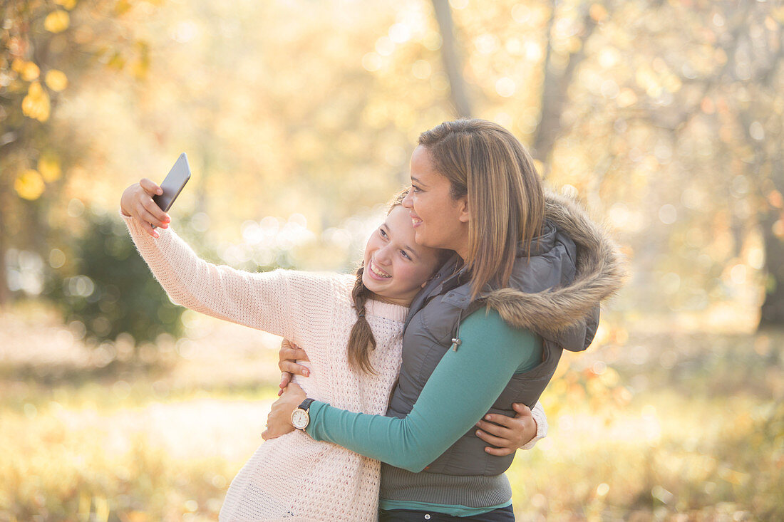 Mother and daughter taking selfie