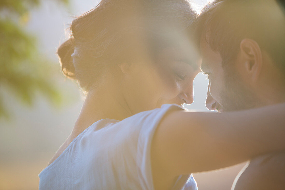 Close up affectionate couple hugging