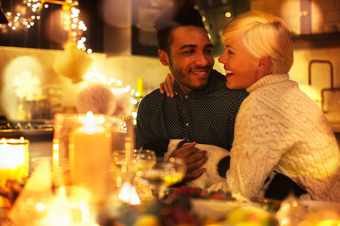 Couple with dog at Christmas table