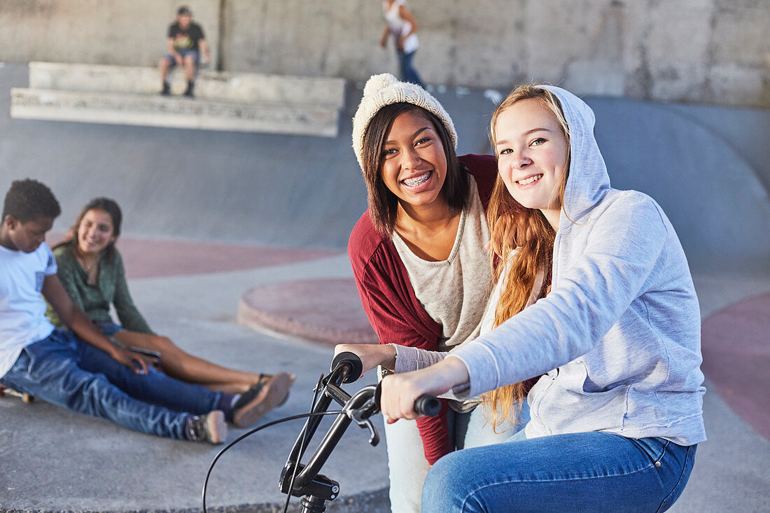 Teenage girls with BMX bicycle