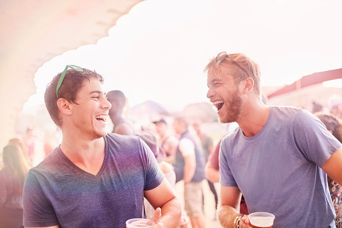 Men drinking at music festival