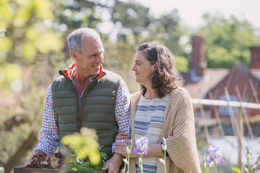 Smiling couple shopping in plant nursery