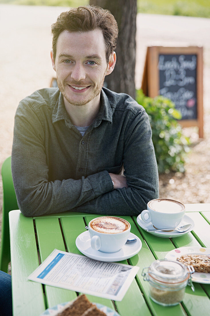 Man enjoying cappuccino table