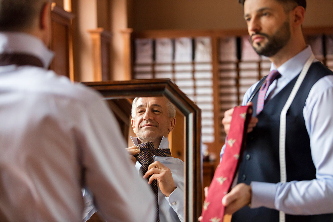 Tailor showing ties to businessman