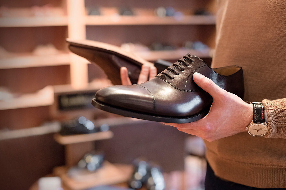 Businessman browsing dress shoes