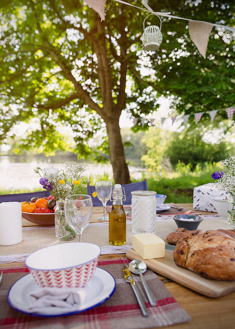 Bread and butter on table at lakeside