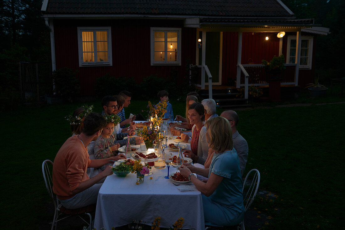 Family enjoying candlelight dinner
