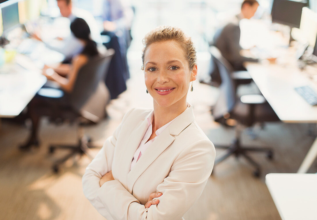 Businesswoman with arms crossed in office