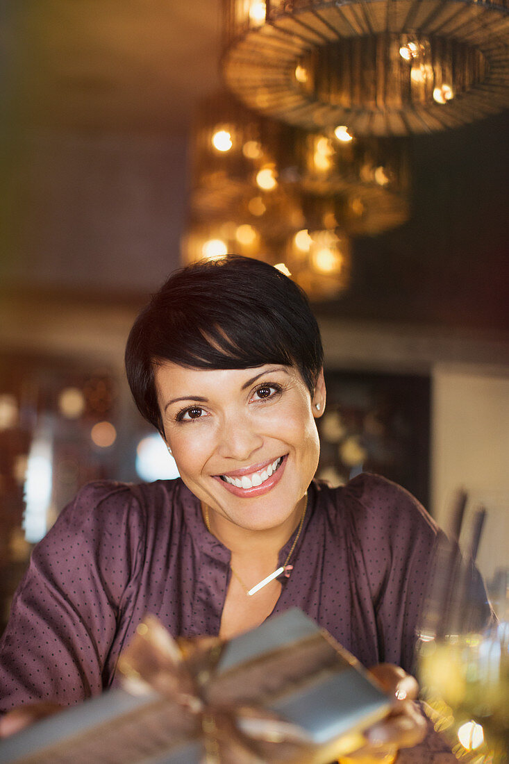 Portrait smiling woman giving gift