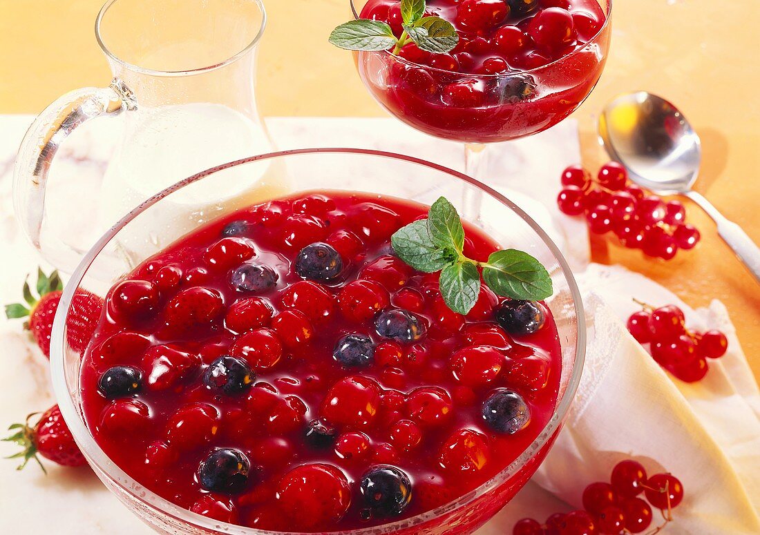Berry cream in a glass bowl and a dessert glass