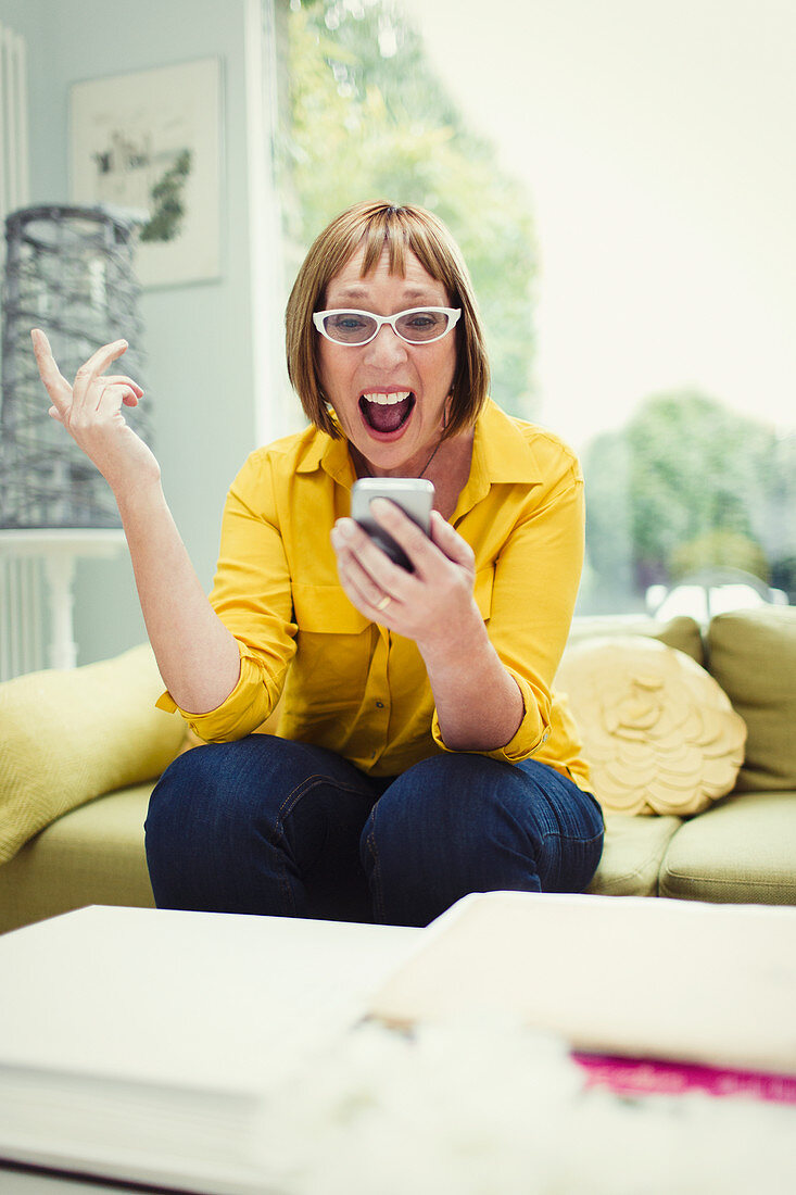 Surprised mature woman receiving good news