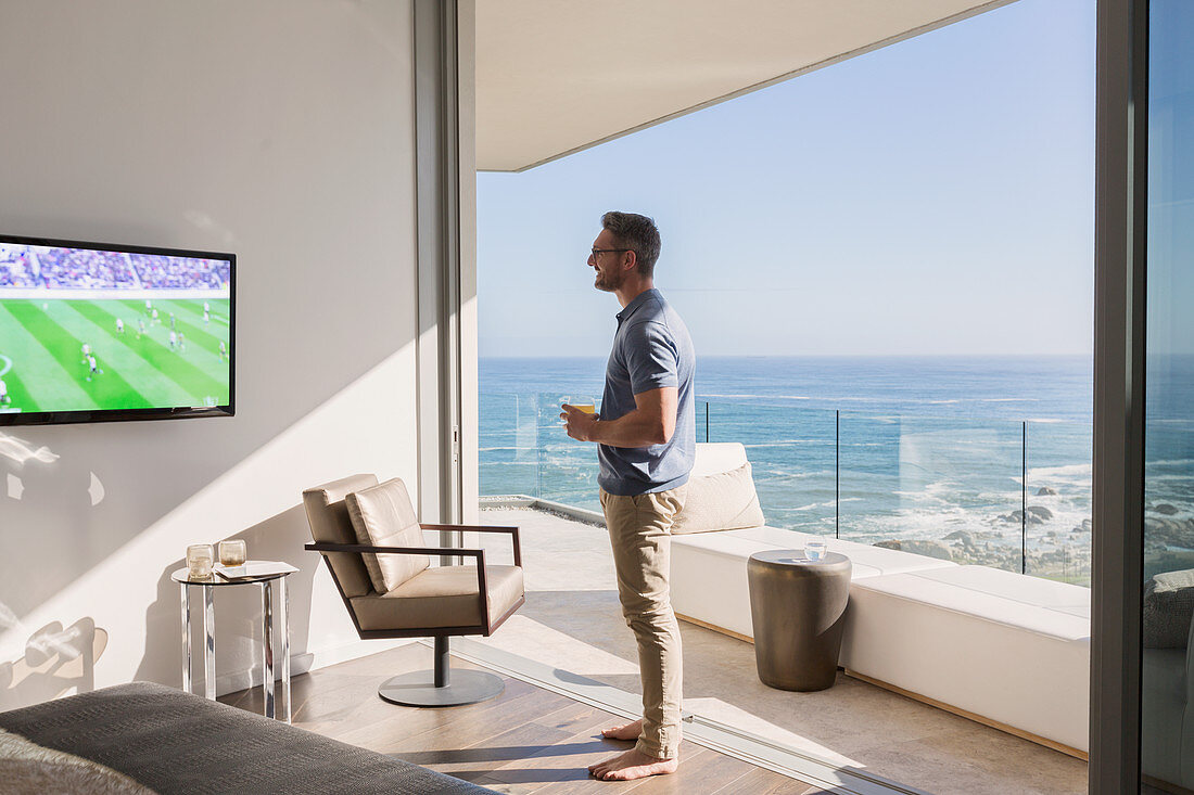 Man watching soccer on TV
