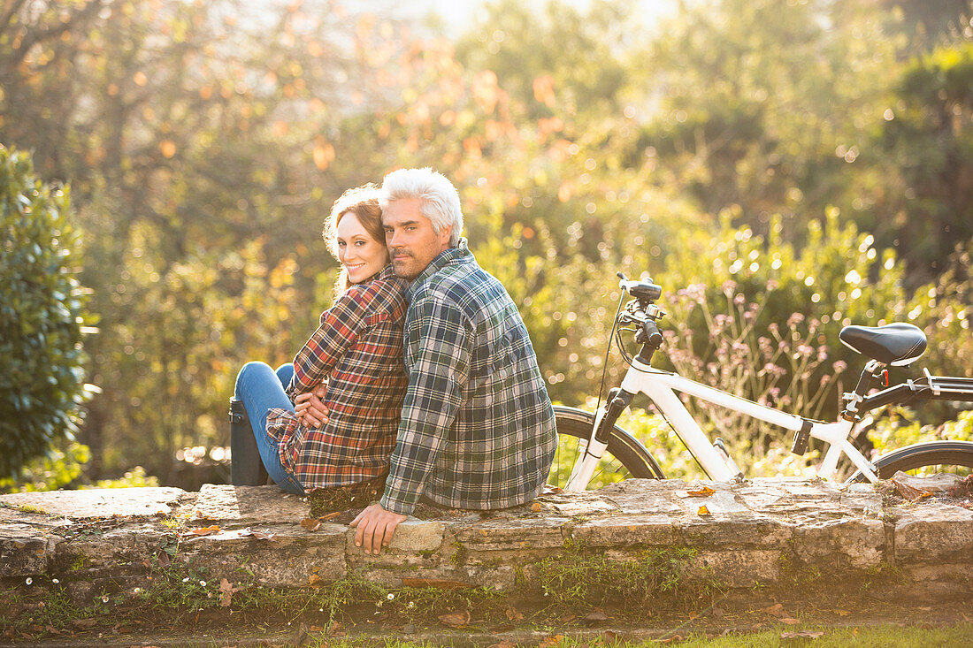 Portrait affectionate couple with bicycle