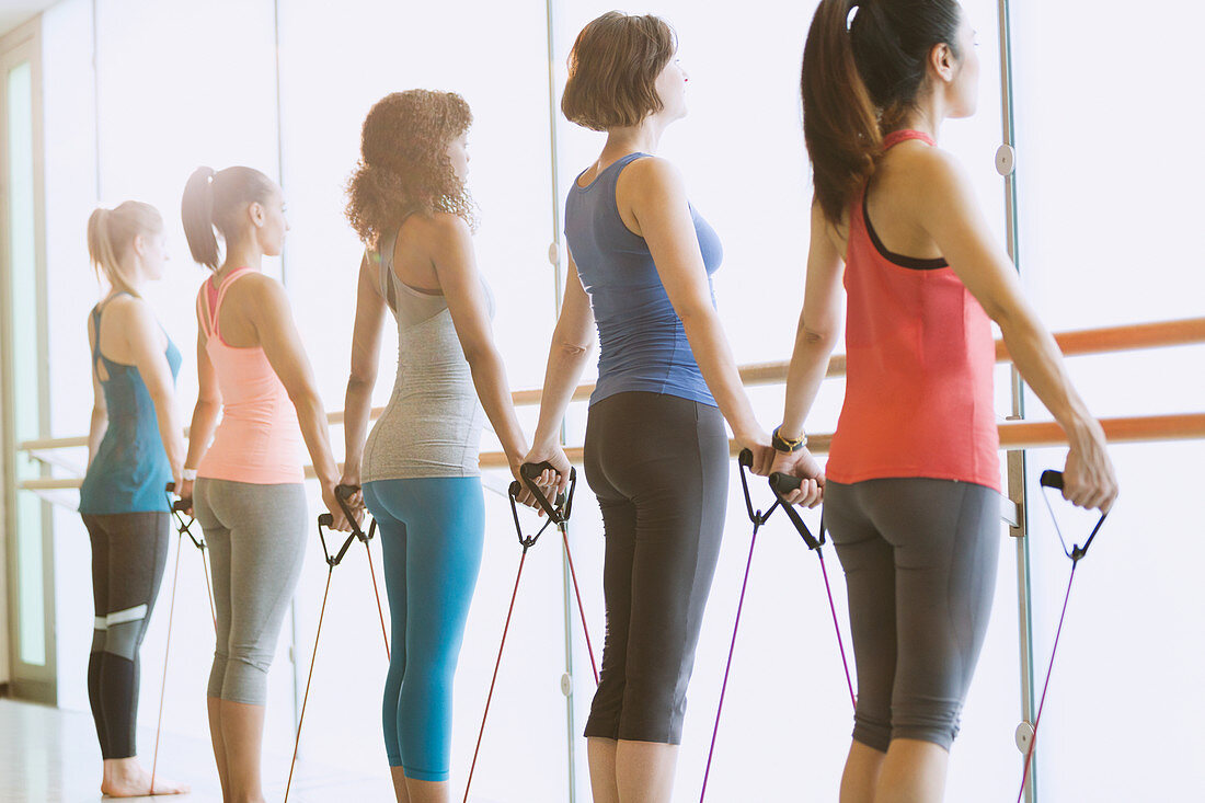 Women exercising at barre