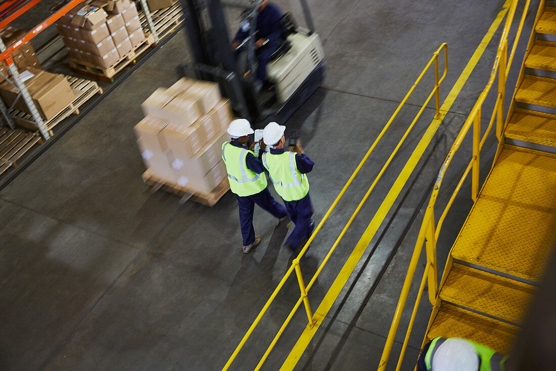 Forklift and workers on the move